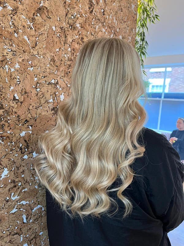 striking blonde hair colour with big curls at chester hairdressers